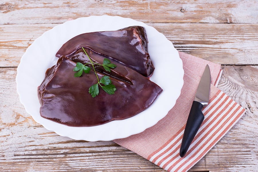 bigstock-Raw-Liver-On-A-White-Plate-On--447463909-min